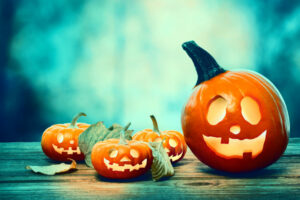 Halloween pumpkins on a spooky forest at night